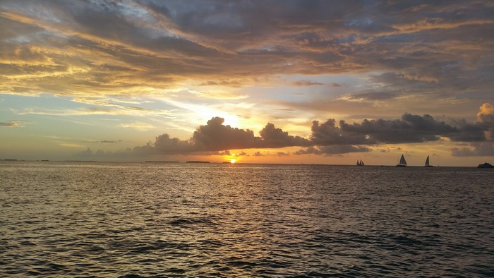 Sailboats on the sea at sunset