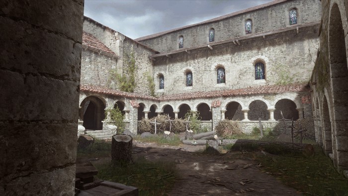 A Plague Tale Innocence courtyard with stained glass windows