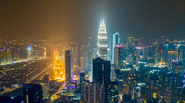 Kuala Lumpur skyline at night with Petronas Towers