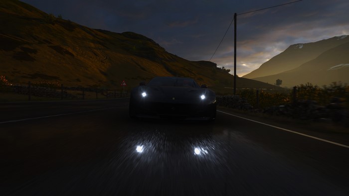 Dark car driving on a wet road in Forza Horizon 4