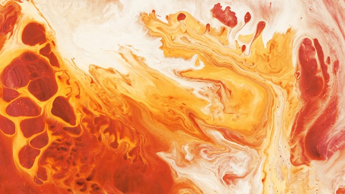 Abstract fluid art with red, orange, and yellow colors