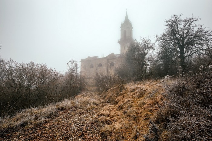 Abandoned church in the mist