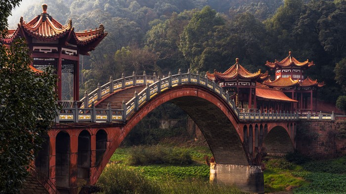Chinese Bridge with Traditional Architecture in Forest