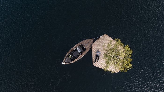 Floating island with a boat and a person