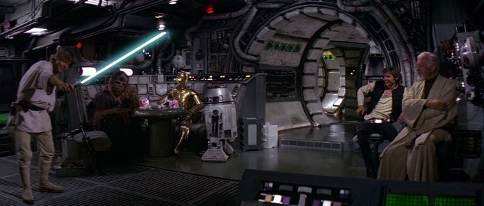 Luke Skywalker with lightsaber in Millennium Falcon with Star Wars characters
