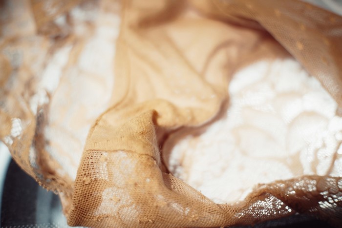 Close-up of tan lace panties