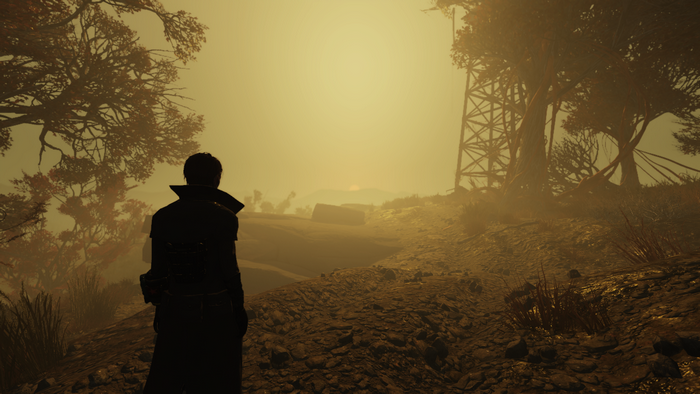 Man in a trench coat in a post-apocalyptic landscape