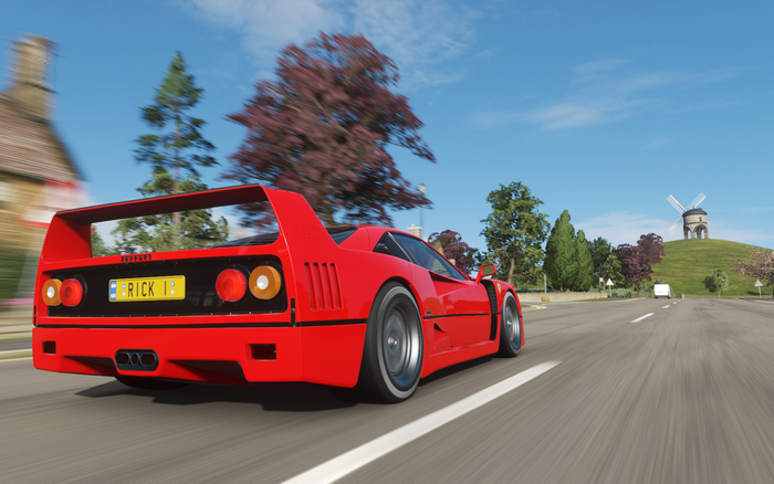 Ferrari F40 driving on a road in Forza Horizon 4