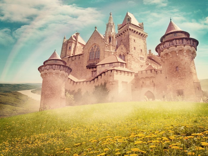 Castle on a hill with flowers and rainbow