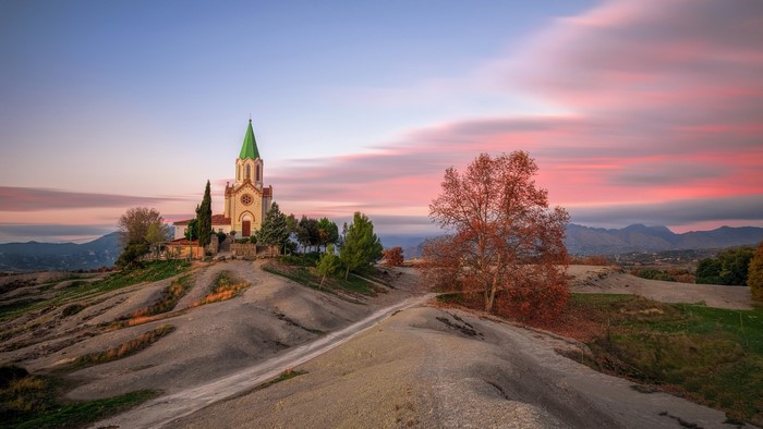 Church on a hill in Catalonia at sunset