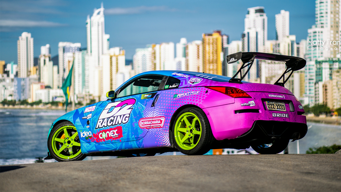Nissan 350Z with custom paint and rear wing in cityscape