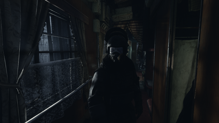 Man in gas mask on a train