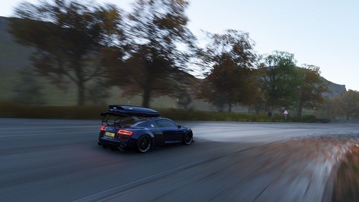 Audi R8 GT with roof box on a road in fall
