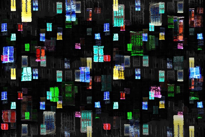 Colorful reflections of windows on water at night