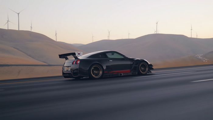 Black Nissan GT-R Nismo with spoiler on highway
