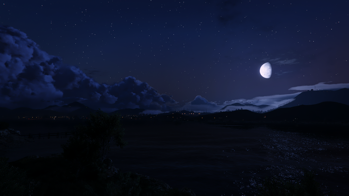 Night landscape with moon and stars over a town