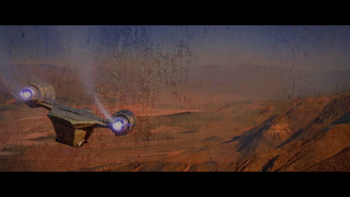 The Mandalorian's Razor Crest flying over a desert planet