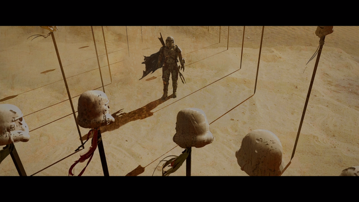 The Mandalorian in a desert with helmets on sticks