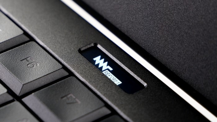 Laptop keyboard with illuminated logo