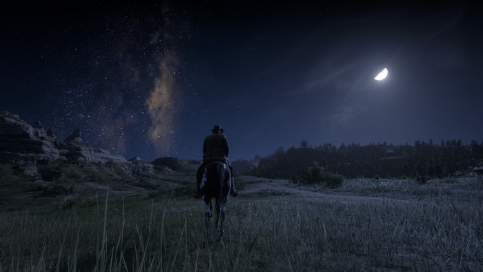 Arthur Morgan from Red Dead Redemption 2 on horseback at night