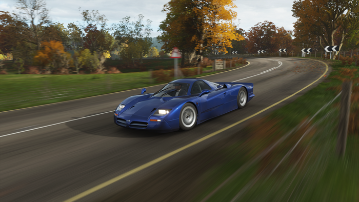 Blue Nissan R930 racing car on a road in Forza Horizon 4