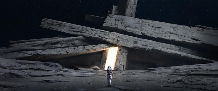 Astronaut approaching glowing portal in alien landscape