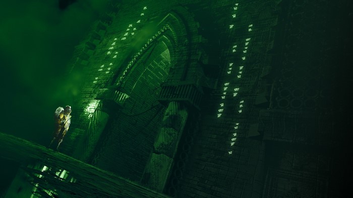Guillaume Hochart in a dark, green, ancient structure