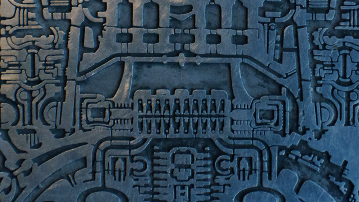 Abstract metallic relief artwork