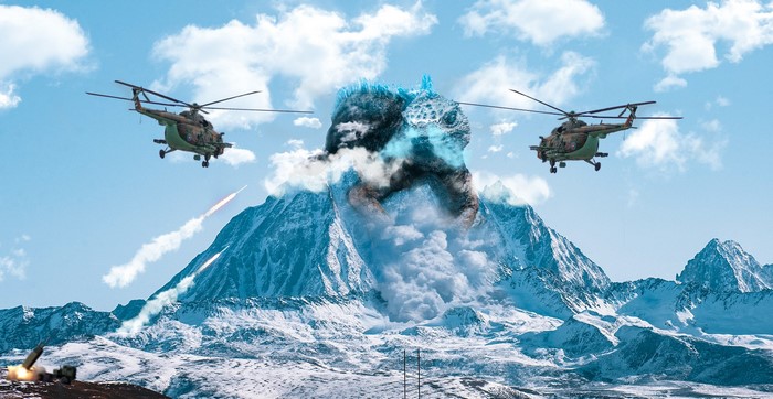 Godzilla emerging from snowy mountains with helicopters and missile launch