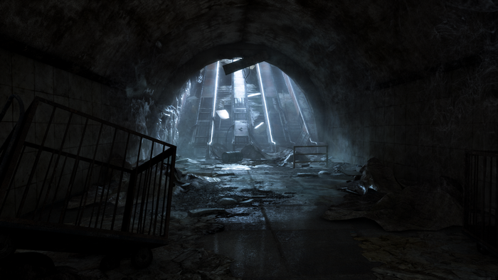 Escalators in a dark, abandoned subway tunnel