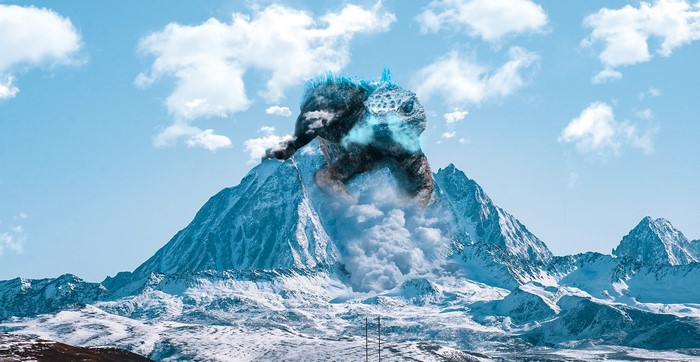 Godzilla emerging from a snowy mountain