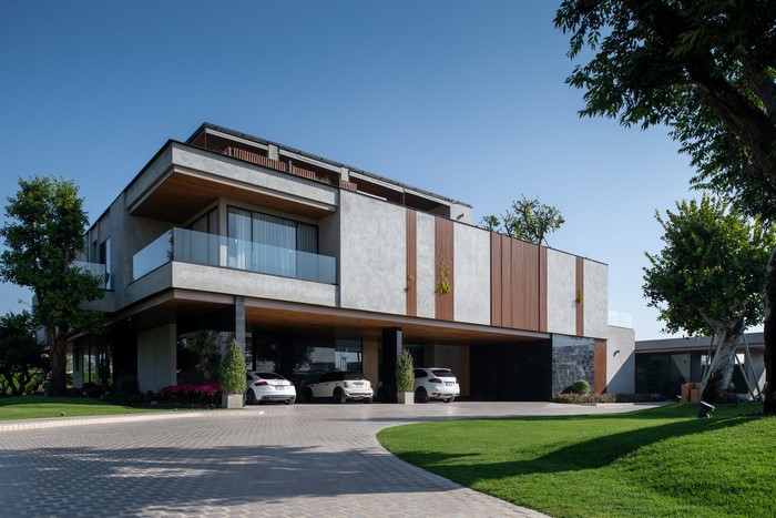 Modern house with cars and trees