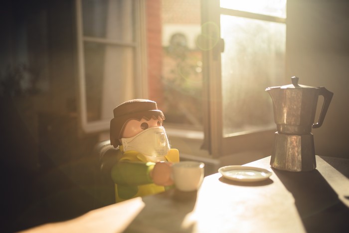 Playmobil figure with mask and coffee maker