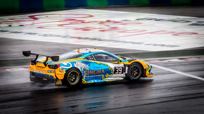 Ferrari 488 GT race car on a wet track