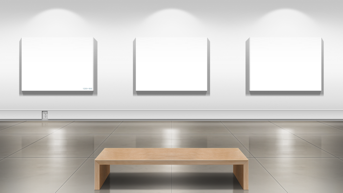 Art gallery with blank canvases and bench