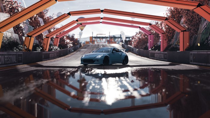 Blue car on a wet road at Forza Horizon Festival