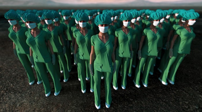 Group of women in green scrubs and masks