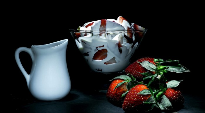 Strawberries with cream and a pitcher