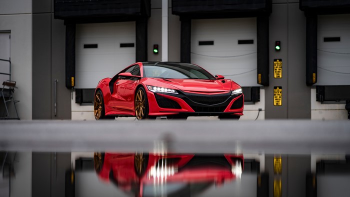 Red Honda NSX mk2 sports car with reflection