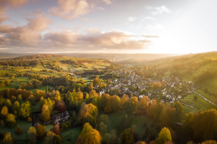 Aerial view of a village in the English countryside at sunset