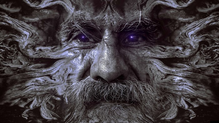 Close-up of an old man's face with glowing purple eyes and roots