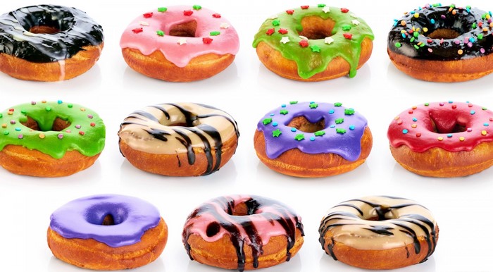 Assortment of colorful donuts with various toppings
