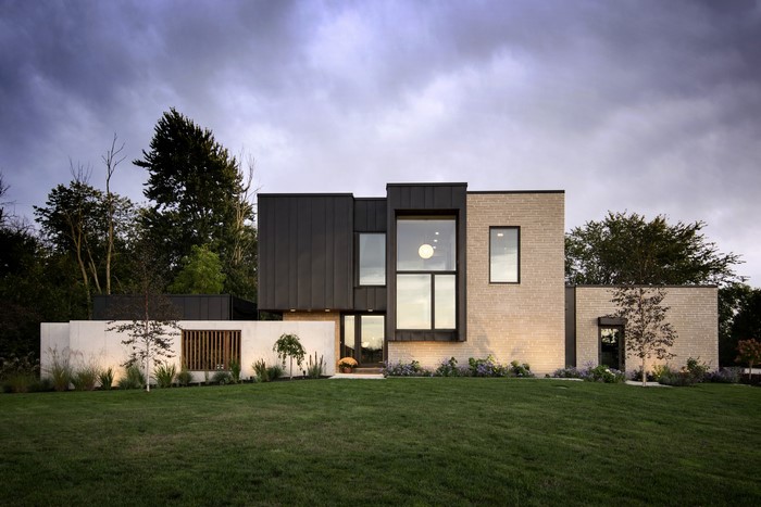 Modern house with large windows and brick exterior