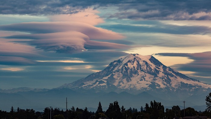 Mount Rainier with lenticular clouds at sunset