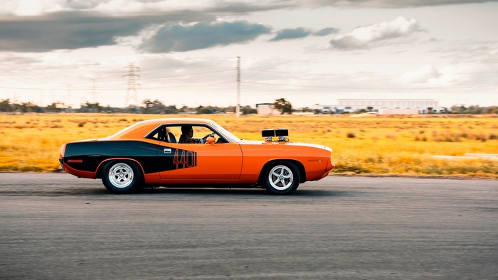 Orange and black Plymouth Barracuda with "440" decal