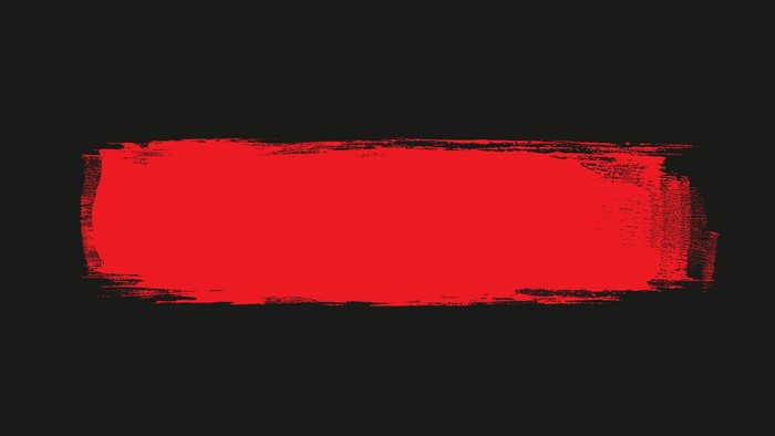 Red brush stroke on black background