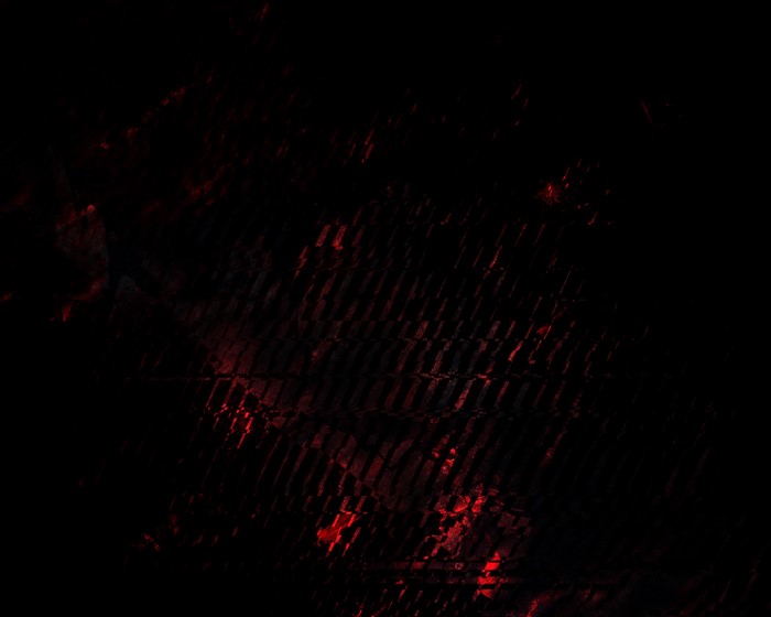 Abstract dark texture with red highlights