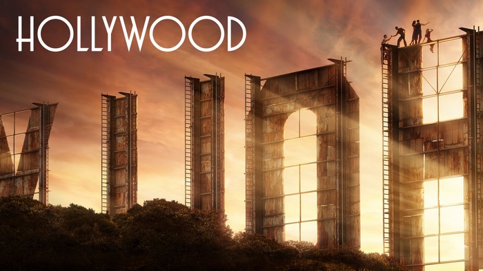Hollywood sign with people on top