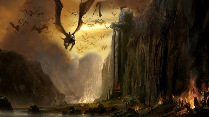 Dragons flying over a fiery mountain pass with a large statue