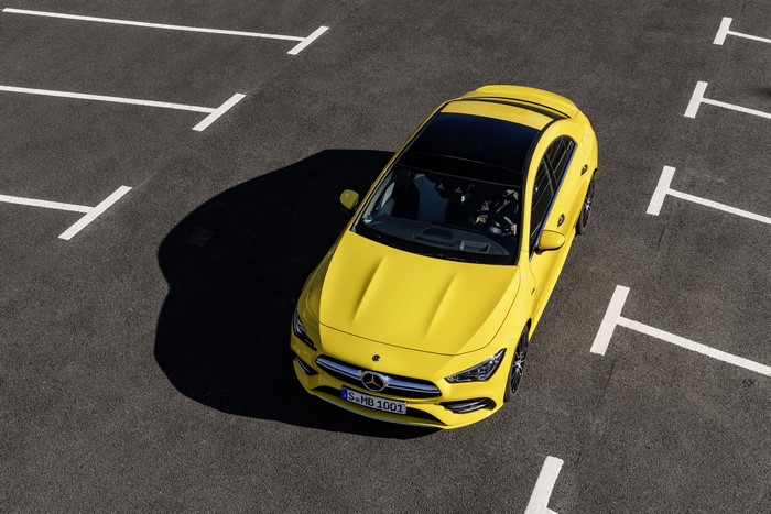 Yellow Mercedes-Benz CLA parked in a lot